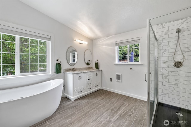 13520 Burn Rd, Arlington, WA 98223 - bathroom with double vanity, lofted ceiling, heating unit, a shower stall, and a soaking tub