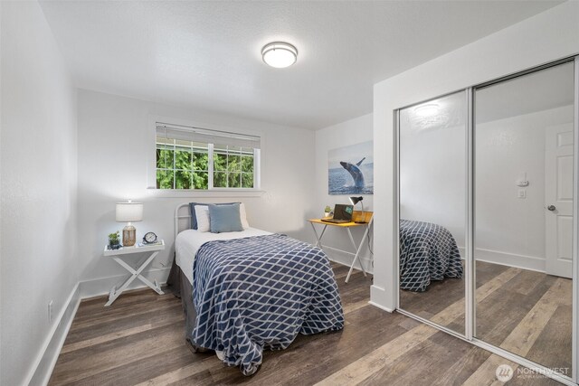 13520 Burn Rd, Arlington, WA 98223 - bedroom with wood finished floors, baseboards, and a closet