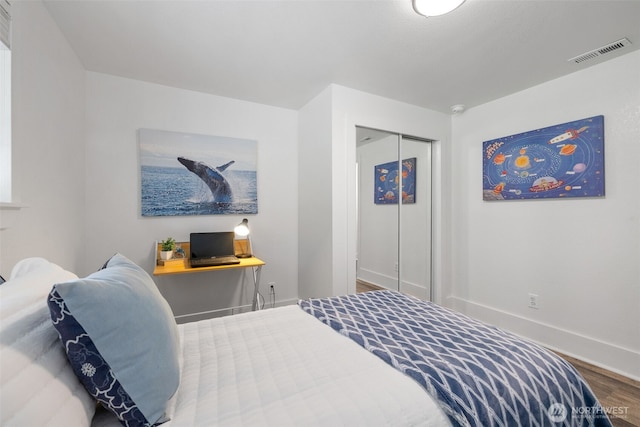 13520 Burn Rd, Arlington, WA 98223 - bedroom featuring wood finished floors, baseboards, and a closet