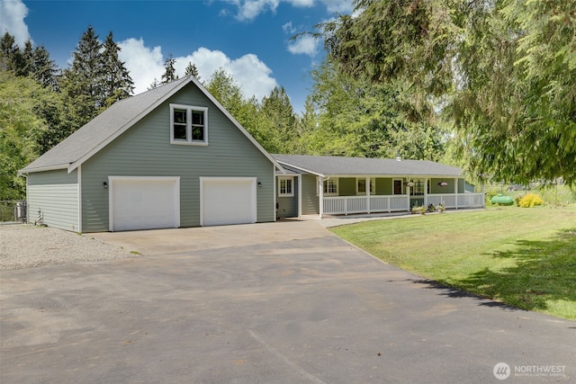 13520 Burn Rd, Arlington, WA 98223 - view of front of property with a porch, a garage, a front lawn, and driveway