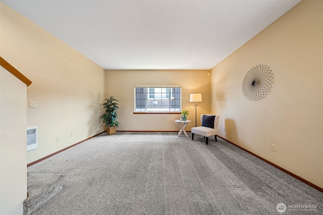 unfurnished room featuring carpet flooring and baseboards