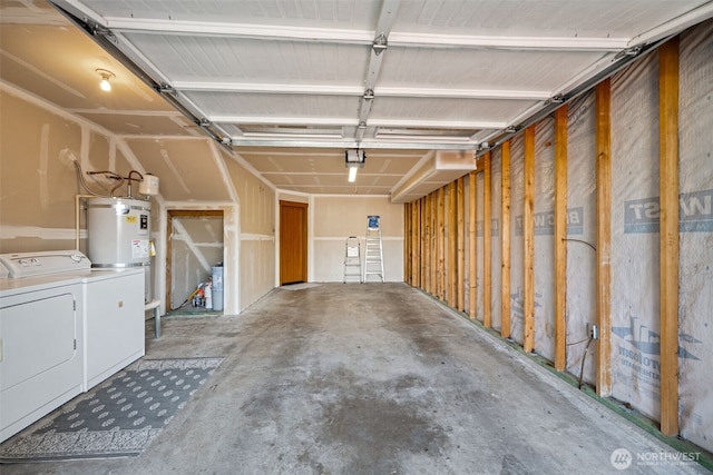 garage with washing machine and dryer and strapped water heater