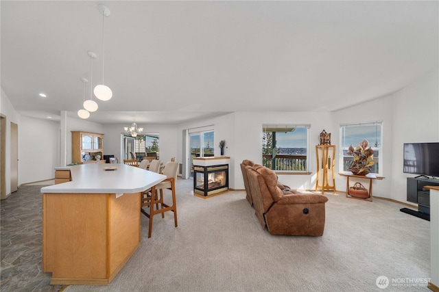 1166 Daniels Ave, Bremerton, WA 98312 - living area featuring a chandelier, light colored carpet, recessed lighting, and a multi sided fireplace