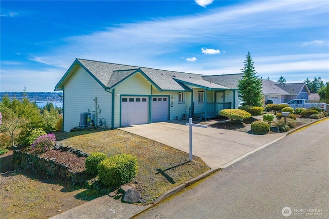 1166 Daniels Ave, Bremerton, WA 98312 - ranch-style house with a garage, concrete driveway, central AC, and a shingled roof