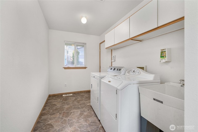 1166 Daniels Ave, Bremerton, WA 98312 - washroom featuring cabinet space, independent washer and dryer, baseboards, and stone finish flooring