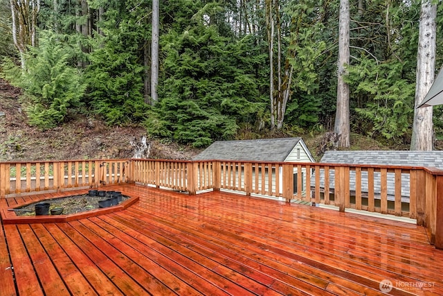 7819 Tolt River Rd NE, Carnation, WA 98014 - wooden terrace featuring an outdoor structure and a forest view
