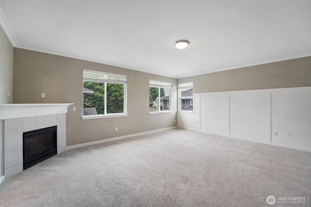 17702 SE 265th Ct, Covington, WA 98042 - unfurnished living room with crown molding, a tiled fireplace, and carpet flooring