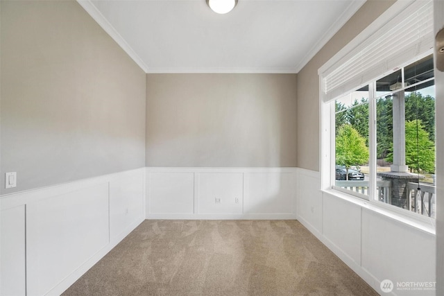 17702 SE 265th Ct, Covington, WA 98042 - empty room with crown molding, a wainscoted wall, carpet floors, and a decorative wall