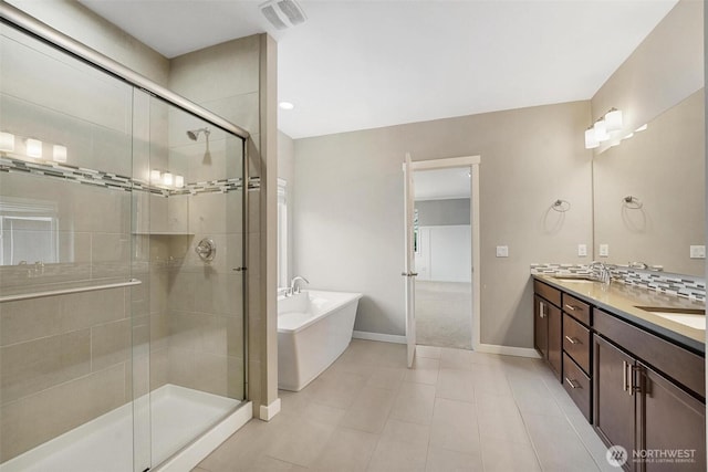 17702 SE 265th Ct, Covington, WA 98042 - bathroom featuring a freestanding bath, double vanity, a shower stall, and tile patterned flooring