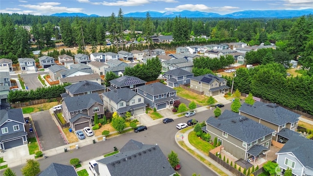 17702 SE 265th Ct, Covington, WA 98042 - aerial perspective of suburban area featuring a mountainous background and a heavily wooded area