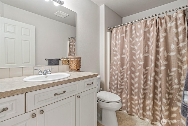 4316 Crystal Lane Loop SE, Puyallup, WA 98372 - full bathroom featuring toilet, vanity, and tile patterned flooring