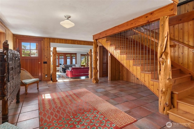14010 SW Bates Rd, Vashon, WA 98070 - entryway with wood walls and stairs