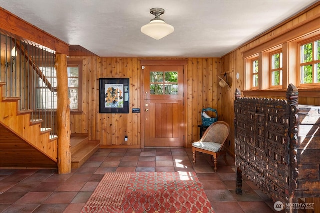 14010 SW Bates Rd, Vashon, WA 98070 - foyer with plenty of natural light, stairs, and wood walls