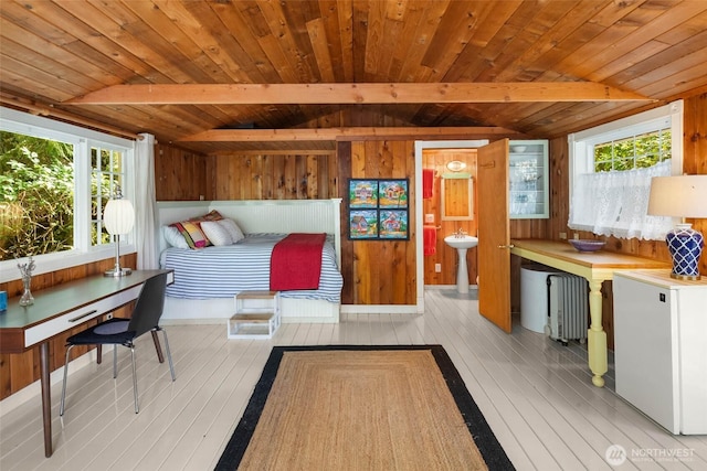14010 SW Bates Rd, Vashon, WA 98070 - bedroom featuring multiple windows, hardwood / wood-style flooring, wooden ceiling, wood walls, and fridge