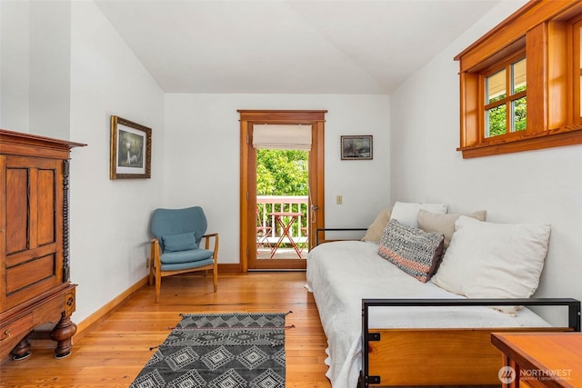 14010 SW Bates Rd, Vashon, WA 98070 - sitting room with vaulted ceiling, light wood-type flooring, and baseboards