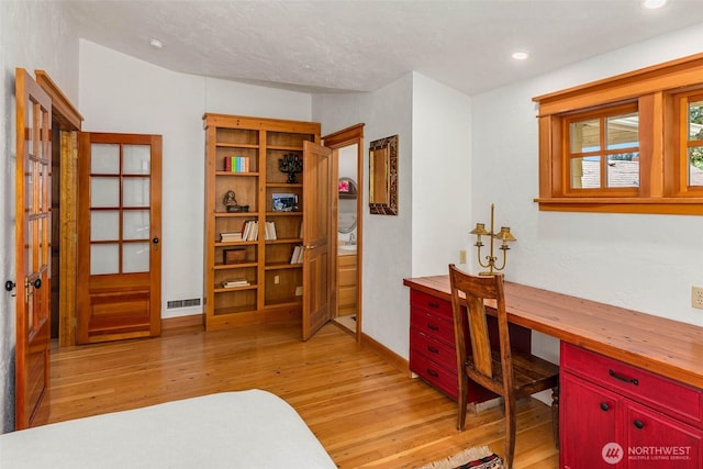 14010 SW Bates Rd, Vashon, WA 98070 - home office with light wood-style floors, recessed lighting, and baseboards