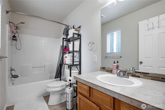 full bath featuring toilet, shower / tub combo with curtain, vanity, and tile patterned flooring