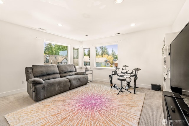living area with carpet floors, baseboards, and recessed lighting