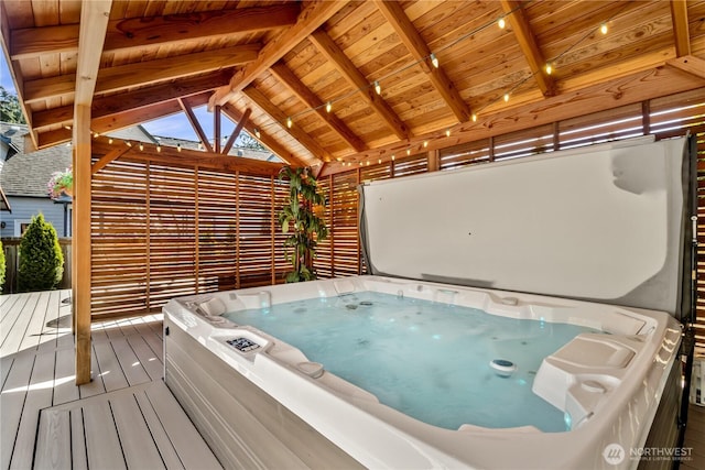 wooden terrace featuring a hot tub