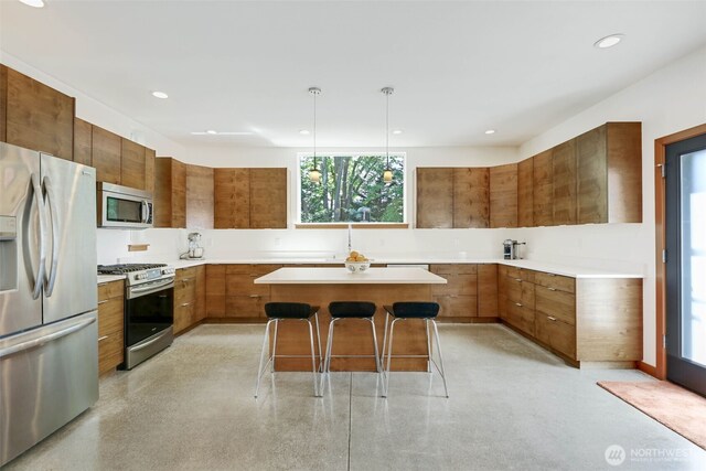 14016 30th Ave NE, Seattle, WA 98125 - kitchen featuring stainless steel appliances, modern cabinets, brown cabinetry, and recessed lighting
