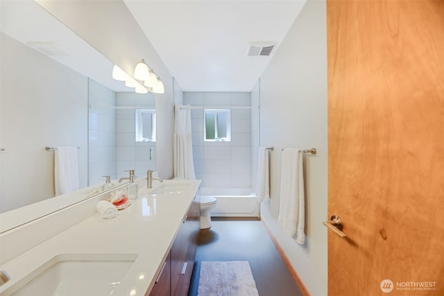 14016 30th Ave NE, Seattle, WA 98125 - full bathroom featuring toilet, shower / bath combination with curtain, double vanity, and baseboards