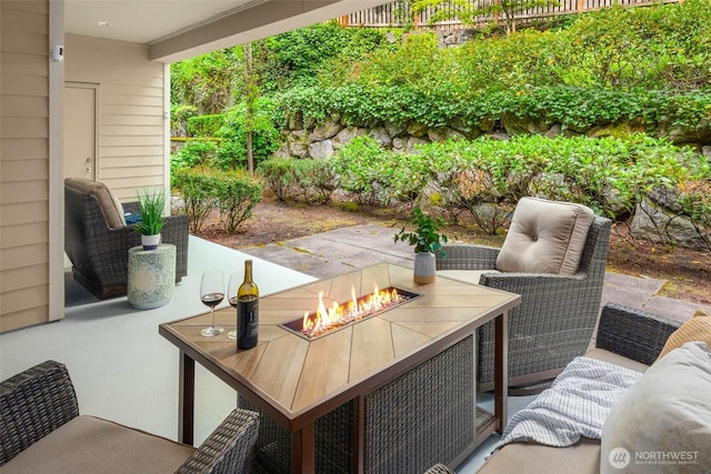 view of patio featuring a fire pit