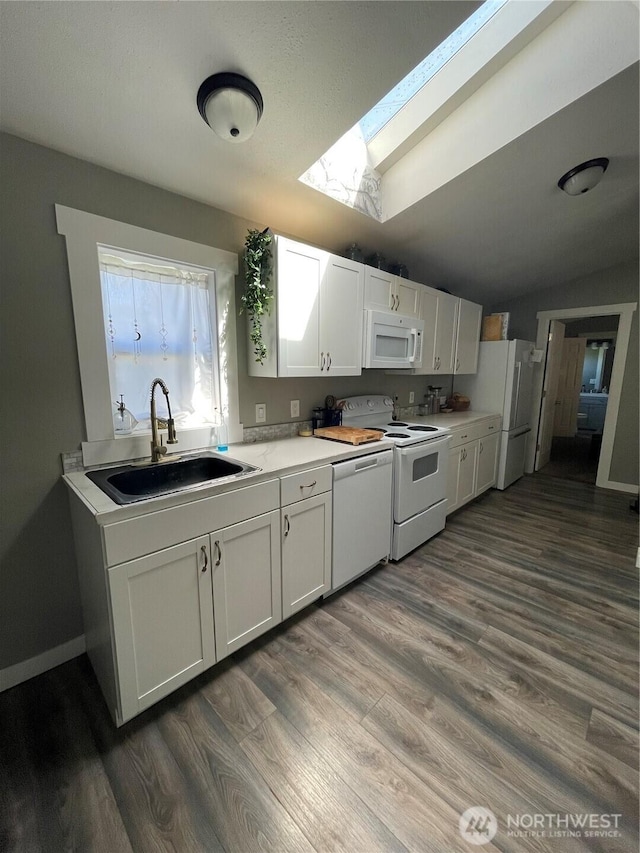 5600 Mt Solo Rd Unit 114, Longview, WA 98632 - kitchen featuring white appliances, white cabinets, dark wood-style floors, light countertops, and lofted ceiling