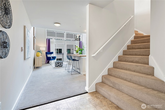 2415 2nd Ave Unit 743, Seattle, WA 98121 - staircase featuring carpet and baseboards