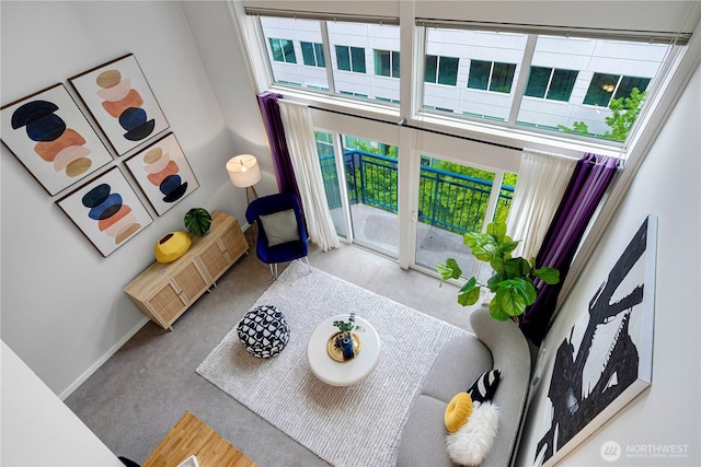 2415 2nd Ave Unit 743, Seattle, WA 98121 - carpeted living room featuring baseboards