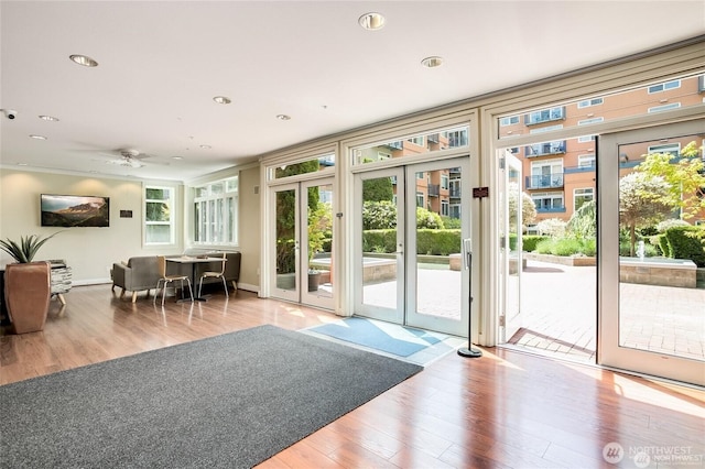 2415 2nd Ave Unit 743, Seattle, WA 98121 - doorway with wood finished floors, ceiling fan, recessed lighting, and baseboards