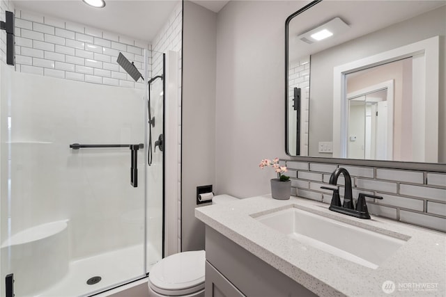 full bathroom with toilet, backsplash, a stall shower, vanity, and recessed lighting