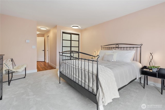 bedroom with carpet floors and baseboards