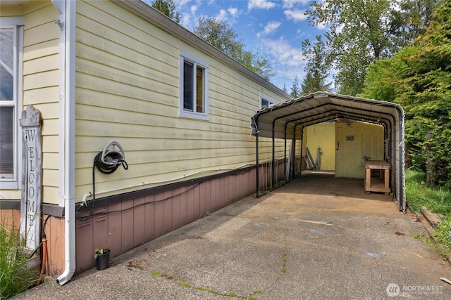 212 Old Owen Rd Unit 46, Sultan, WA 98294 - view of side of home featuring a detached carport and driveway