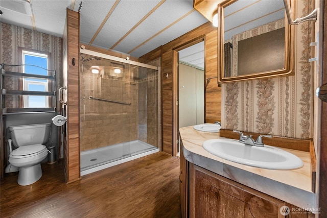 212 Old Owen Rd Unit 46, Sultan, WA 98294 - full bathroom with a shower stall, wood finished floors, toilet, and vanity