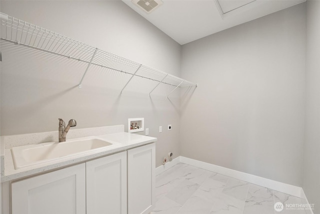 laundry room with electric dryer hookup, light marble finish flooring, washer hookup, cabinet space, and baseboards