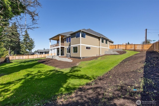 rear view of house featuring a balcony and central air condition unit
