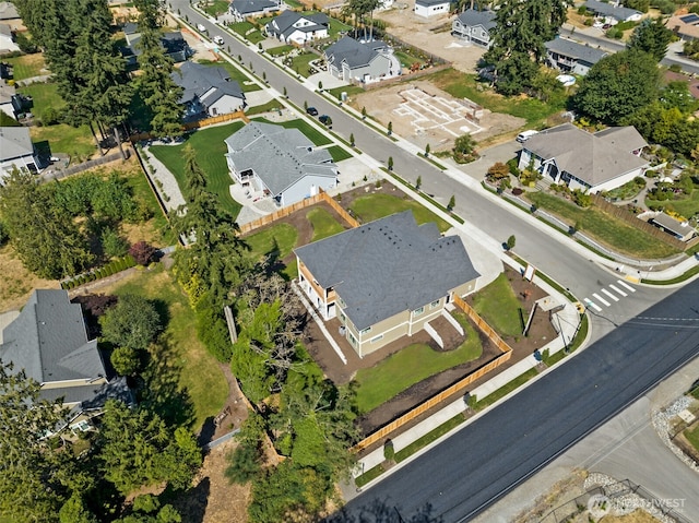aerial view of property and surrounding area with nearby suburban area