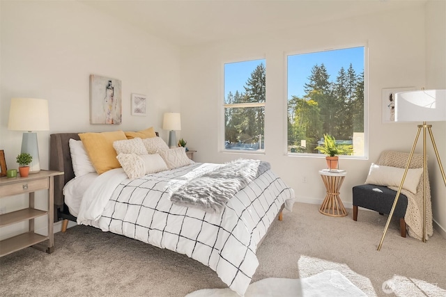 bedroom with carpet flooring and baseboards