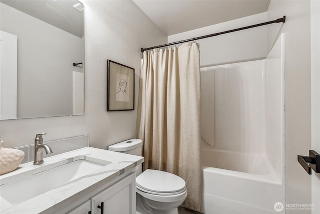 full bath featuring toilet, vanity, and shower / bath combo