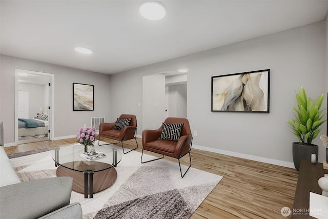living room with light wood-style floors and baseboards