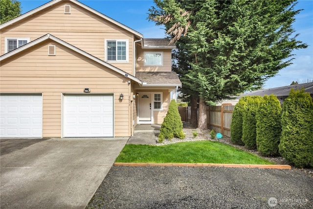 view of front facade featuring fence, driveway, a garage, and a shingled roof
