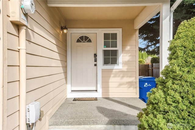 doorway to property with fence