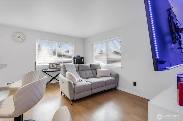 living room featuring plenty of natural light and wood finished floors
