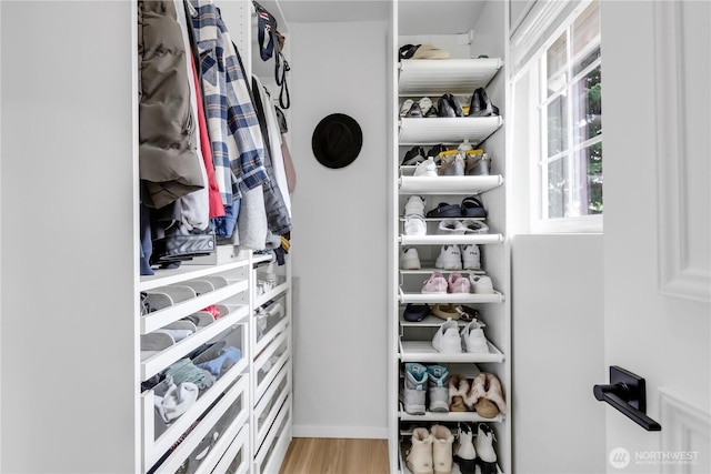spacious closet with light wood-style flooring