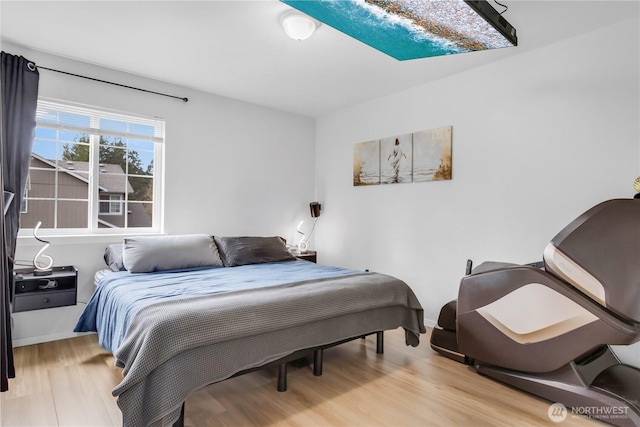 bedroom featuring light wood finished floors