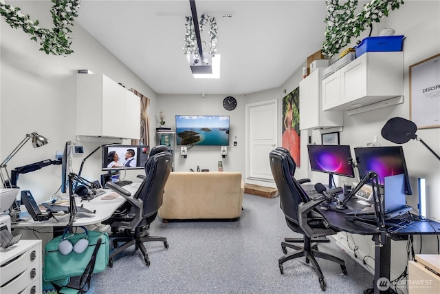 office area featuring speckled floor