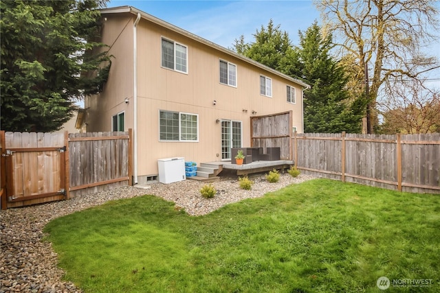 rear view of house with a wooden deck