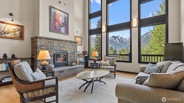 510 Dempsey Rd, Leavenworth, WA 98826 - living area featuring wood finished floors, a high ceiling, and a fireplace