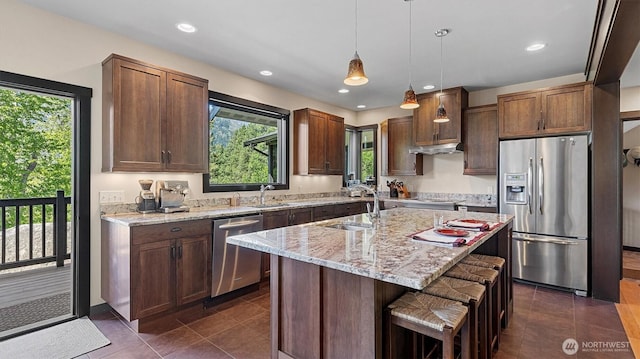 510 Dempsey Rd, Leavenworth, WA 98826 - kitchen with appliances with stainless steel finishes, a sink, plenty of natural light, light stone countertops, and recessed lighting