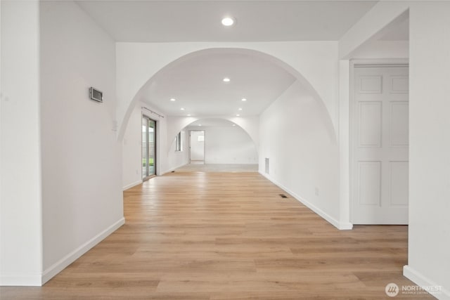 133 Bradley St, Walla Walla, WA 99362 - hall with arched walkways, light wood-type flooring, baseboards, and recessed lighting